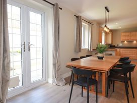 A dining room with a table and chairs at 3 Rope Walk in St. Austell