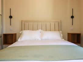 A bedroom with a bed and bedside tables at 3 Rope Walk St. Austell