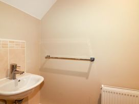 A bathroom with a sink and tap at 3 Rope Walk in St. Austell