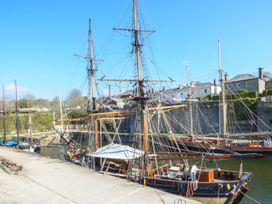 A harbor with ships docked by the water at 3 Rope Walk Duporth near Charlestown
