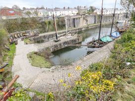 A view of boats at a dock with a pathway at 3 Rope Walk Duporth near Charlestown
