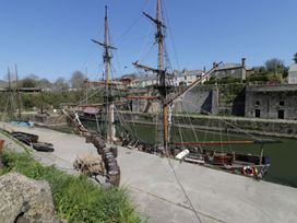 Boats and ships at a dock near buildings at 3 Rope Walk Duporth near Charlestown