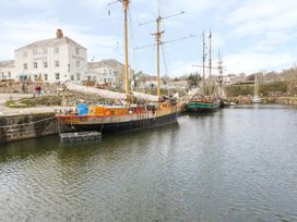Boats in a harbor by Pier House at 3 Rope Walk, Duporth near Charlestown