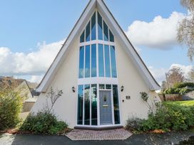 A house entrance with large windows at Lady Of Lourdes in Whitchurch, Herefordshire