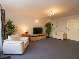 A living room with a sofa and television at Lady Of Lourdes in Whitchurch, Herefordshire