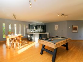 A dining room with a pool table and dining table at Lady Of Lourdes in Whitchurch, Herefordshire