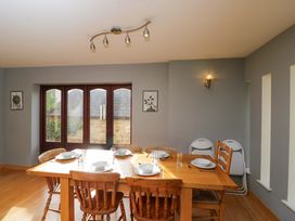 A dining room with a table set for meals at Lady Of Lourdes in Whitchurch, Herefordshire