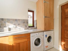 A laundry room with washing machine and dryer at Lady Of Lourdes in Whitchurch, Herefordshire