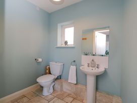 A bathroom with a toilet and sink at Lady Of Lourdes in Whitchurch, Herefordshire