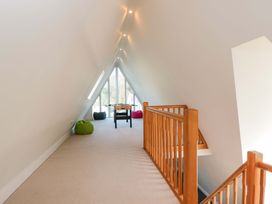 An attic space with a table and bean bags at Lady Of Lourdes in Whitchurch, Herefordshire