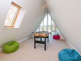 A games room with a foosball table and bean bags at Lady Of Lourdes in Whitchurch, Herefordshire