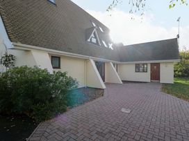 An exterior view of a house with a pathway and garden at Lady Of Lourdes in Whitchurch, Herefordshire