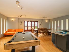 A recreation room with a pool table and dining area at Lady Of Lourdes Whitchurch, Herefordshire