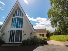 A house with large windows and a garden at Lady Of Lourdes in Whitchurch, Herefordshire