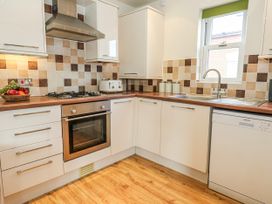 A kitchen with an oven and stove at Rodwell Holt in Weymouth