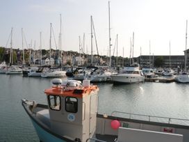 A marina with boats in the water at Rodwell Holt in Weymouth