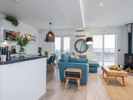 A living room with a sofa and coffee table at Adelaide in Portreath