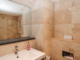 A bathroom with a sink and shower at Clifford Lodge Barn