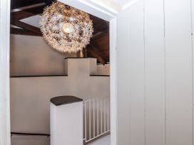 An indoor space with a chandelier in view at Clifford Lodge Barn