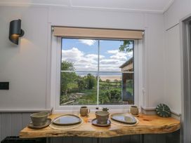 A kitchen window with a view of the outdoors at Little Hut in Grange-Over-Sands