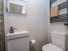 A bathroom with a sink and toilet at Little Hut in Grange-Over-Sands
