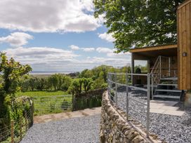 An outdoor area with gravel and steps at Little Hut in Grange-Over-Sands