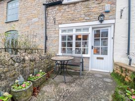 An outdoor area with a table and chairs at Stones Bakery in Wedmore