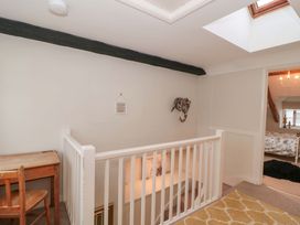 A landing with a desk and chair at Stones Bakery in Wedmore