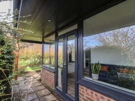 An outdoor area with a door and window at Little Poppes Lawn in Holditch near Hawkchurch
