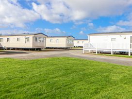 A view of caravans in an outdoor area at St Michaels Caravan Park - 236 Towyn