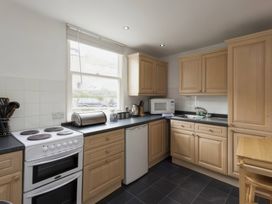 A kitchen with an oven and sink at Snugglers Cove in Dartmouth