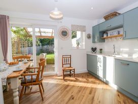 A kitchen with a table and chairs at 27 Oversands View 