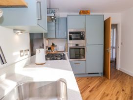 A kitchen with cabinets and appliances at 27 Oversands View