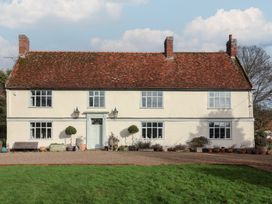 A house with windows and a pathway at Farmhouse in Beccles