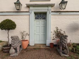 An entrance with lion statues and plants at the Farmhouse in Beccles