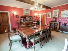 A dining room with a table and chairs at the Farmhouse in Beccles