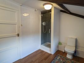 A bathroom with a shower and toilet at Farmhouse in Beccles