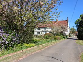 A house surrounded by garden and trees at Winston Hall in Beccles