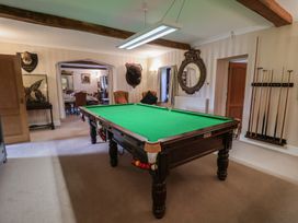 A games room with a pool table at Winston Lodge in Beccles