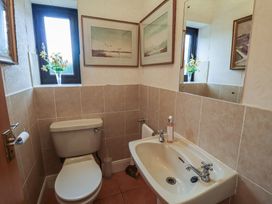 A bathroom with a sink and toilet at Winston Lodge in Beccles