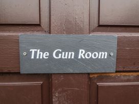 A sign that reads The Gun Room on a door at The Gun Room in Beccles
