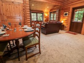 A dining room with a table and chairs at Little Bears Hideaway @ 23 Lakeside, Felmoor Park near Felton