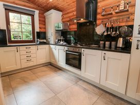 A kitchen with cabinets and countertop at Little Bears Hideaway @ 23 Lakeside Felmoor Park near Felton