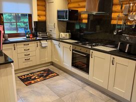 A kitchen with appliances and countertops at Little Bears Hideaway @ 23 Lakeside Felmoor Park near Felton
