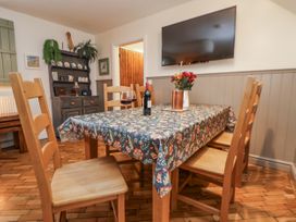 A dining room with a table and chairs at The Stables in Prestatyn