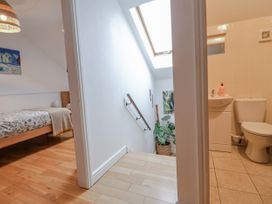 A bathroom with a toilet and sink at The Stables in Prestatyn