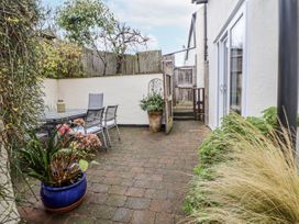 An outdoor area with a table and chairs at The Stables in Prestatyn