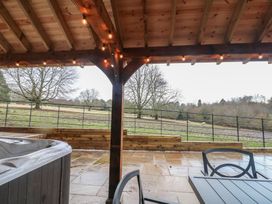 An outdoor area with a hot tub and furniture at Park View Lodge