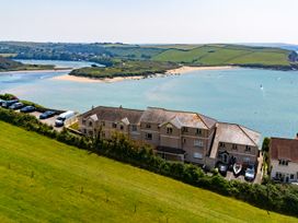 An aerial view of houses near a beach and water at 6 Avon Quillet Bigbury-On-Sea