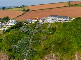 A landscape with houses and stairs on a hillside at 6 Avon Quillet Bigbury-On-Sea